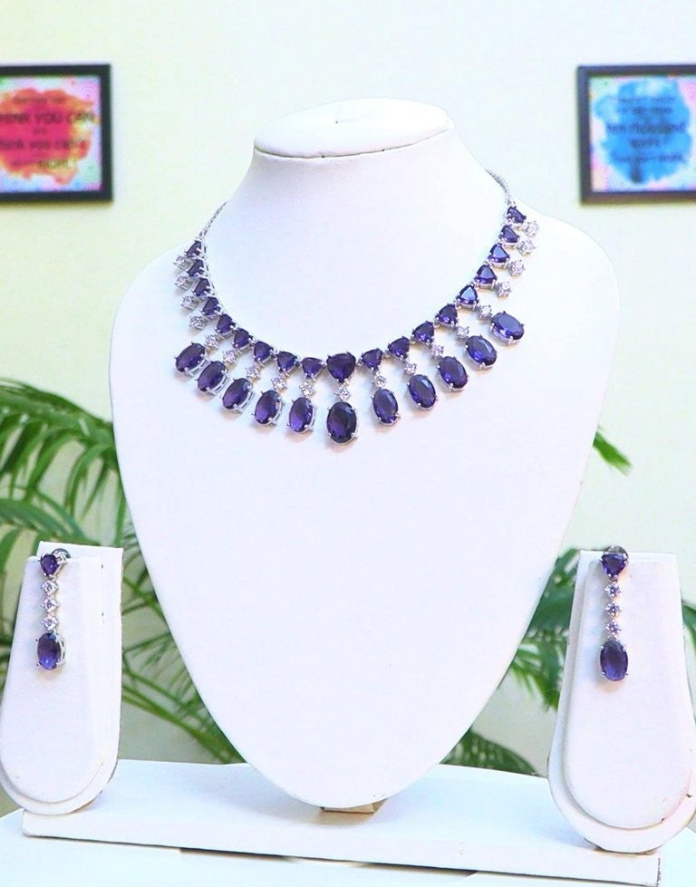 A Classic Cz Set on Fire! It can be worn as choker or necklace. Beautiful combo of purple doublet and silver with premium quality of Cz's
