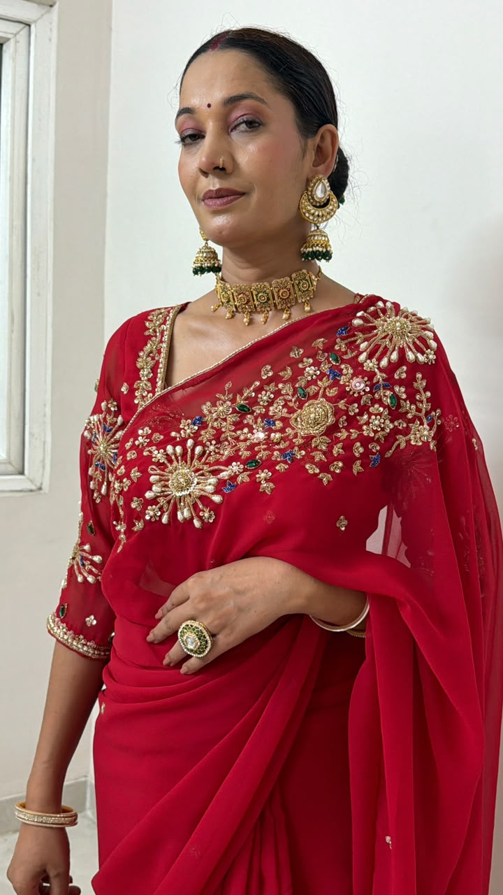 Red Saree with heavy hand work of seqyism, pearls, cutdana work and green stonework Maha Collection
