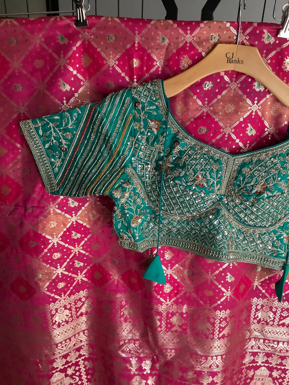 Teal Banarasi Saree with Heavy Embroidered Pink Blouse Ajmera