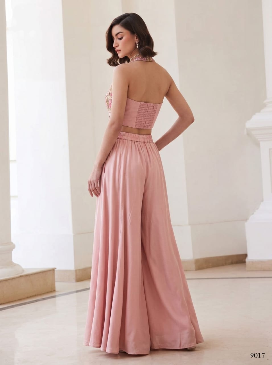Green two-piece set with floral halter waistcoat and light green wide-leg palazzo pants, front view