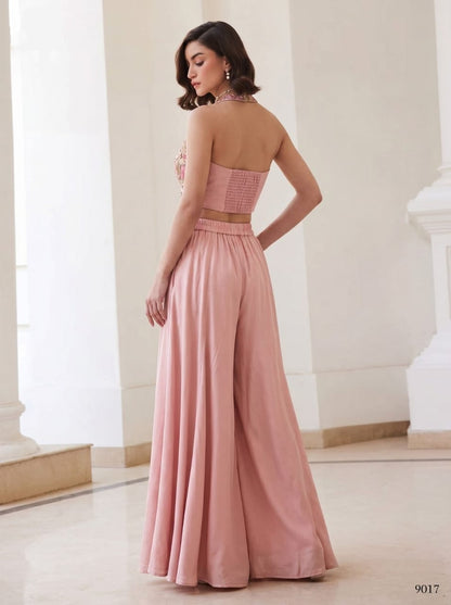 Green two-piece set with floral halter waistcoat and light green wide-leg palazzo pants, front view