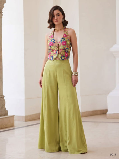 Close-up of multicolor floral button-front halter waistcoat with green palazzo waistband
