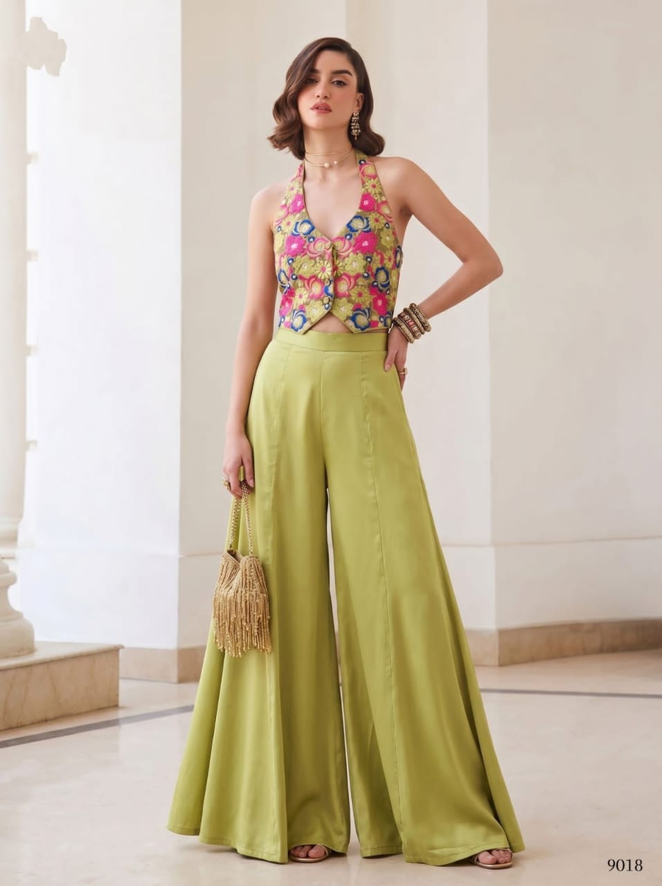 Rose pink embroidered halter waistcoat and flowing wide-leg palazzo pants, front view