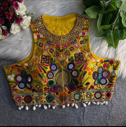Yellow Kutchi Halter Blouse – Heavy Mirror Work, Rabari Embroidery & Cowrie Shell Fringe Rutva Fashions